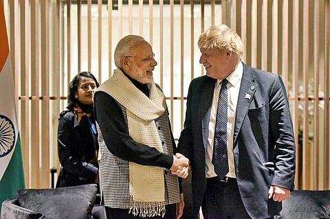 PM Narendra Modi with his English counterpart Boris Johnson. (Photo| PTI)