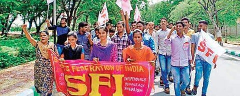 Students’ Federation of India protesting against alleged irregularities in the evaluation of answer sheets of BCom second semester exams (Photo |EPS)