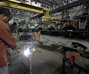 An employee works beside Ordnance factory in Medak district, Hyderabad. (File photo/Reuters)