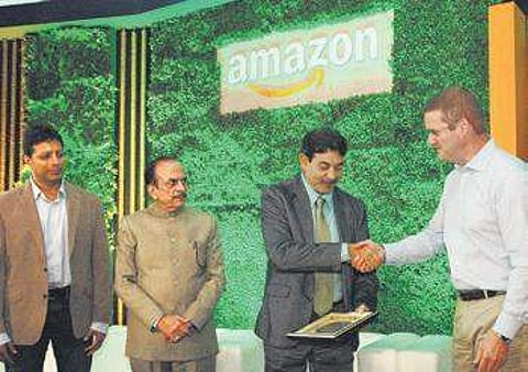ITE&C principal secretary Jayesh Ranjan shakes hands with Amazon VP John Schoettler (Photo | EPS, S SENBAGAPANDIYAN)
