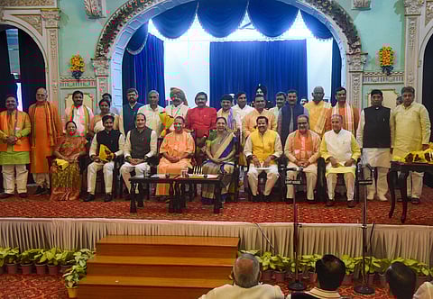 Uttar Pradesh Governor Anandiben Patel and Chief Minister Yogi Adityanath in a group photo with the newly inducted ministers after their swearing-ing ceremony at Raj Bhawan in Lucknow Wednesday August 21 2019. | PTI