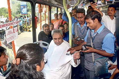 Chief Minister Naveen Patnaik purchases a ticket on board ‘Mo Bus’ near BPIA in Bhubaneswar on Tuesday | Express