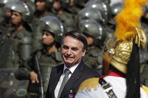 Brazils President Jair Bolsonaro arrive to attend a military ceremony for the Day of the Soldier, at Army Headquarters in Brasilia, Brazil. (Photo | AP)