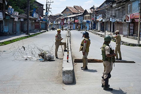 Security personnel stand guard at a check point during restrictions after Centre abrogated Article 370 and divided Jammu and Kashmir into two union territories in Srinagar Sunday August 18 2019. | (File | PTI)