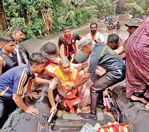 Abdul (in life jacket) helps saving trapped families in last year's floods