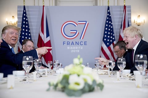 US President Donald Trump and Britain's Prime Minister Boris Johnson attend a working breakfast at Hotel du Palais on the sidelines of the G-7 summit in Biarritz, France on Sunday. (Photo | AP)