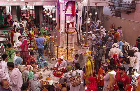 Kashmiri Pandits offer prayers at the replica of Kheer Bhawani temple on the occasion of the annual Kheer Bhawani Mela. (Photo| PTI)