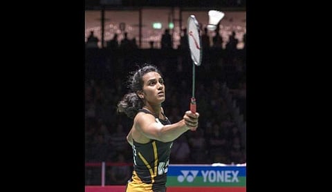 PV Sindhu returns a shuttlecock to Japan's Nozomi Okuhara during their women's singles final match at the BWF Badminton World Championships in Basel. (Photo | AP)