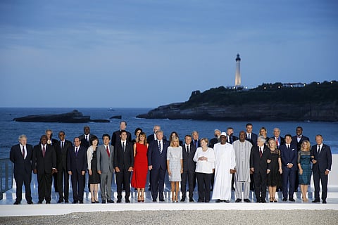 Group of Seven leader and guests pose for the G7 family photo Sunday, Aug. 25, 2019 in Biarritz. (Photo | AP)