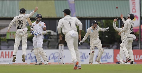 New Zealand's Tom Latham, right, along with others celebrate taking a catch to dismiss Sri Lanka's Suranga Lakmal during day five of the second test cricket match between Sri Lanka and New Zealand in Colombo. (Photo | AP)