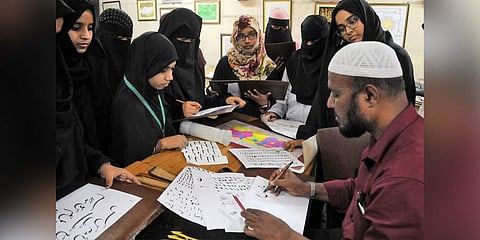 Calligraphy artist Mohd Abdu Gaffar with his students at the Idara-e-Adabiyat-e-Urdu; (left) A close up of his sheet (Photo | S Senbagapandiyan, EPS)