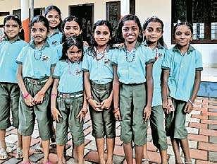 Children of Govt LP School, Valayanchirangara, in their new uniform