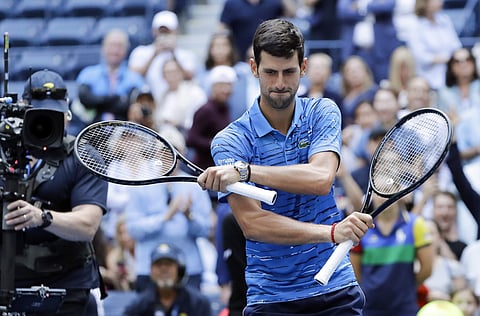 Novak Djokovic, of Serbia, dances for fans after beating Roberto Carballes Baena, of Spain, during the first round of the US Open tennis tournament. (Photo | AP)