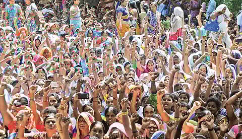 ASHA workers stage protest demanding that State government clears their salary arrears at Lenin Centre in the city on Monday | Prasant Madugula