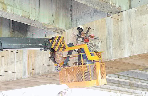 IIT-Madras officials collecting the core samples from Kundannoor flyover (Photo | EPS/ A Sanesh)