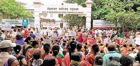 Slum dwellers staging protest in front of collectorate in Baripada (Photo |EPS)