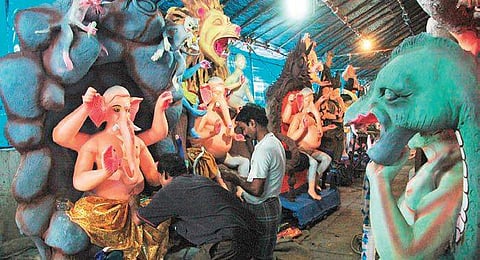 Workers makiing Ganesh idols ahead of Ganesh Chaturti at Chaderghat, Hyderabad on Tuesday. (Photo | S Senbagapandiyan, EPS)