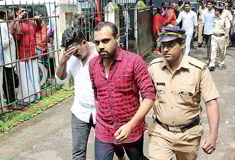 Syanu Chacko, who was convicted in Kevin murder case, coming out of the Principal District and Sessions Court, Kottayam, after hearing the verdict | Express