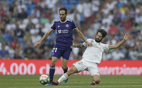 Real Madrid's Isco, right, vies for the ball with Valladolid's Michel during the Spanish La Liga soccer match between Real Madrid and Valladolid at the Santiago Bernabeu stadium in Madrid. (Photo | AP)
