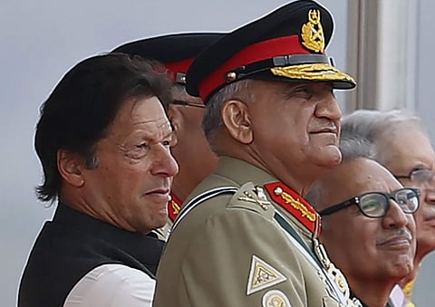 Pakistan's Army Chief Gen. Qamar Javed Bajwa, right, watches a parade with Prime Minister Imran Khan, left, in Islamabad, Pakistan, on 23/09/2019. (Photo | AP)