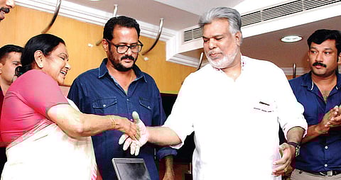 V Joshiy (centre in white shirt)