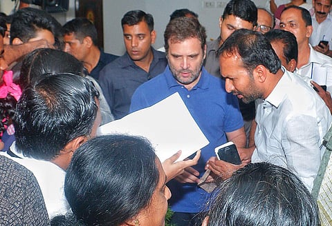 Wayanad MP Rahul Gandhi interacting with traders and public at Sacred Heart Forane Parish Hall Thiruvambady in Kozhikode. (Photo | EPS)