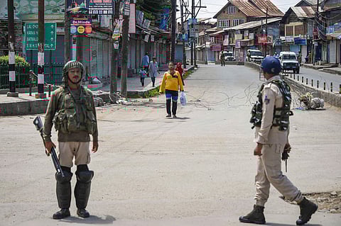Security personnel stand guard at a check point during restrictions after Centre abrogated Article 370 and divided Jammu and Kashmir into two union territories in Srinagar Sunday August 18 2019. | (File | PTI)