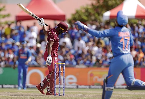 West Indies' Nicholas Pooran, left, reacts before being caught out by India wicket keeper Rishabh Pant, right, during the first Twenty20 international cricket match, Saturday, Aug. 3, 2019, in Lauderhill. (Photo | AP)