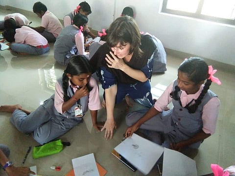 ( Elizabeth Keyton teaching students at the Government Upper Primary School, Muttuchira | EPS )