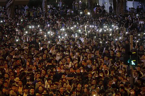 Protesters hold up the lights on their phones as they gather at a demonstration by civil servants in Hong Kong on Friday, Aug. 2, 2019. (Photo | AP)