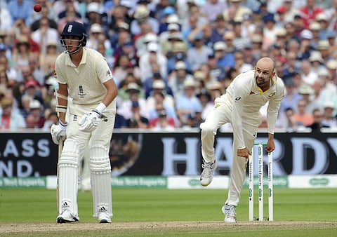 Australia's Nathan Lyon, right, bowls during day three of the first Ashes Test cricket match between England and Australia at Edgbaston in Birmingham. (Photo | AP)