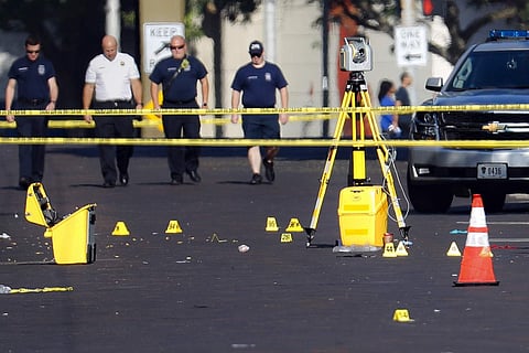 Evidence markers rest on the street at the scene of a mass shooting Sunday, Aug. 4, 2019, in Dayton, Ohio. (Photo | AP)
