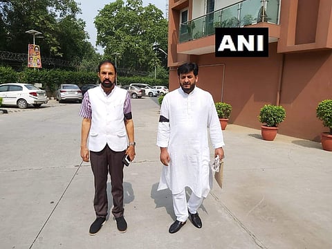 PDP's Rajya Sabha MPs Nazir Ahmad Laway and Mir Mohammad Fayaz don black bands before entering the Parliament, as a mark of protest against the situation in Kashmir. (Photo | ANI, Twitter)