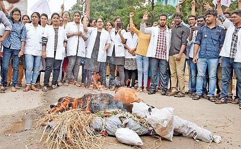 Junior doctors burn an effigy of Union Minister for Health Dr Harsh Vardhan while protesting against the NMC Bill in Hyderabad on Sunday | RVK Rao