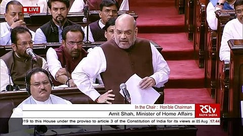 Home Minister Amit Shah in Rajya Sabha on 5 August 2019 announcing the scrapping of Article 370, which gave Jammu and Kashmir a special status. (Rajya Sabha TV screengrab)