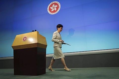 Hong Kong Chief Executive Carrie Lam leaves after a press conference at the Legislative Council in Hong Kong. (Photo | AP)