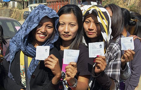Naga women showing their ID-cards prior to casting their votes. (Photo| PTI)