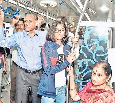 Telangana Governor ESL Narasimhan, along with his wife Vimala on a ride in the Metro from Ameerpet to Nagole on Tuesday (Photo |EPS)