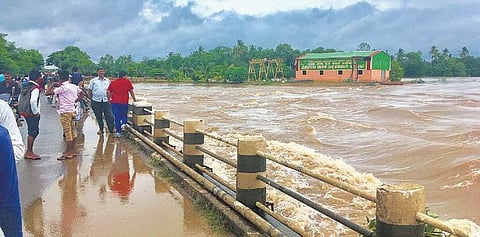 Monsoon fury: The bridge across the Krishna river at Chikkapadasalagi in Bagalkot district on the verge of being submerged on Tuesday | Express