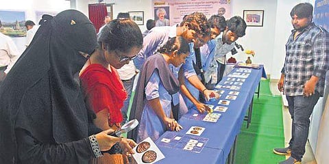 Visitors browsing coins belonging to King Krishnadevaraya’s reign during an exhibition at The Cultural Centre of Vijayawada and Amaravati I P Ravindra Babu