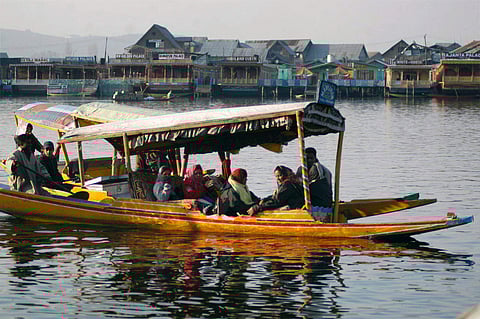 File photo of tourists enjoying on a Shikara in Dal lake in Srinagar. (File Photo | PTI)