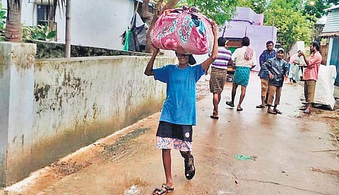 Residents of Polavaram vacating the village after Godavari river bund breaches on Wednesday (Photo| EPS)