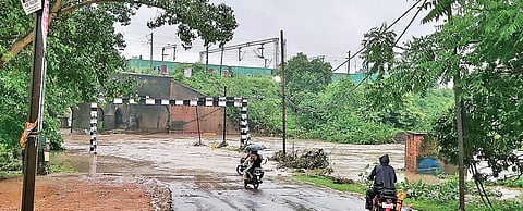 Water flowing over the culvert of Brajrajnagar tunnel road in Jharsuguda (Photo | EPS)