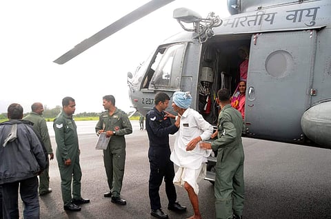 Airforce soldiers rescuing the stranded villagers. (Photo | EPS)