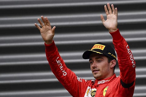 Winner Ferrari's Monegasque driver Charles Leclerc arrives to celebrate on the podium after the Belgian Formula One Grand Prix at the Spa-Francorchamps circuit in Spa. (Photo | AP)