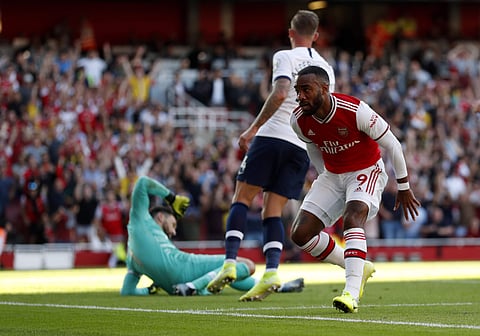 Arsenal's Alexandre Lacazette scores his side's opening goal against Tottenham Hotspur (Photo | AP)