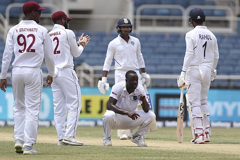 West Indies' Kemar Roach celebrates after he dismissing India's Mayank Agarwal (Photo | AP)