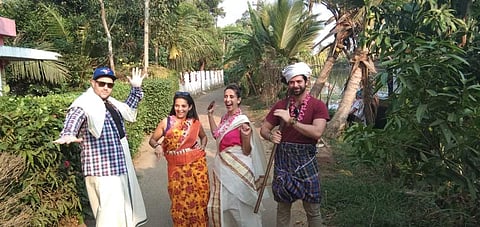 A delegation of foreign tourists enjoy their Onam day out in a countryside village near Kumarakom in Kottayam. (Photo | EPS)