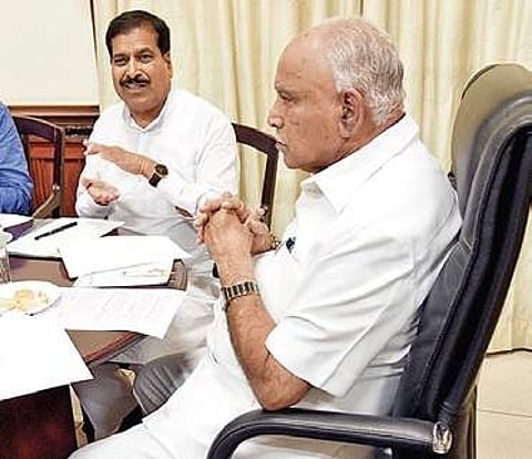 Minister Suresh Angadi with CM B S Yediyurappa at the latter’s office on Monday (Photo |EPS)