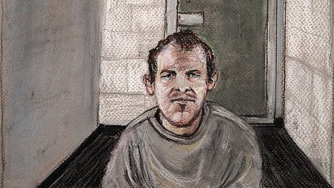 In this courtroom drawing, Brenton Tarrant, the man accused of killing 51 people at two Christchurch mosques on March 15, 2019 appears via video link at the Christchurch District Court, from the maximum security prison in Auckland where he's being held.